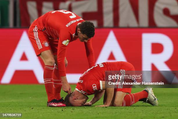 Benjamin Pavard of FC Bayern Munich looks on towards teammate Joshua Kimmich as he looks dejected during the DFB Cup quarterfinal match between FC...
