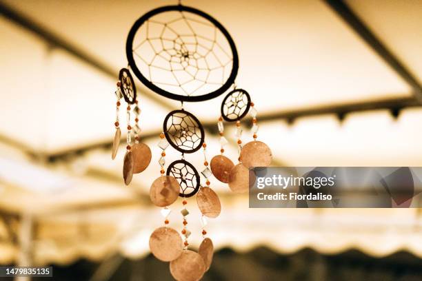 dream catcher hanging in a tent for meditation and yoga - dreamcatcher stock-fotos und bilder