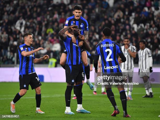 Romelu Lukaku of FC Internazionale celebrates with teammates after scoring the team's first goal during the Coppa Italia Semi Final match between...