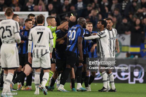 Romelu Lukaku of FC Internazionale reacts towards Juan Cuadrado of Juventus after Lukaku was shown a red card in injury time of the Coppa Italia Semi...