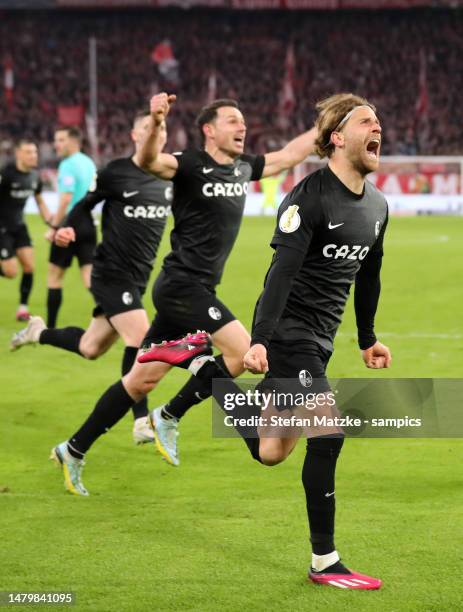 Lucas Hoeler of SC Freiburg celebrates as he scores the goal 1:2 with Nicolas Hoefler of SC Freiburg during the DFB Cup quarterfinal match between FC...