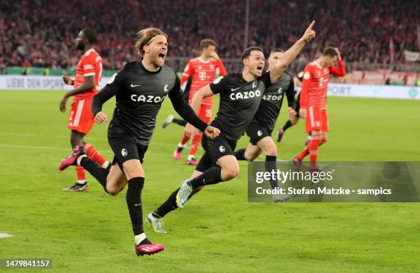 Lucas Hoeler of SC Freiburg celebrates as he scores the goal 1:2 with Nicolas Hoefler of SC Freiburg during the DFB Cup quarterfinal match between FC...