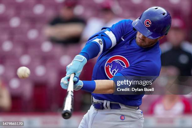 Ian Happ of the Chicago Cubs hits a single in the first inning against the Cincinnati Reds at Great American Ball Park on April 04, 2023 in...