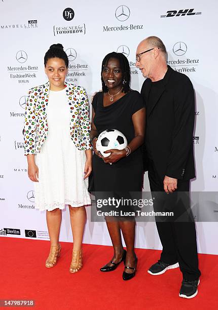 Akini and Auma Obama arrive for the Minx By Eva Lux Show at Mercedes-Benz Fashion Week Spring/Summer 2013 on July 7, 2012 in Berlin, Germany.