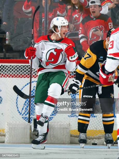 Dawson Mercer of the New Jersey Devils celebrates his hattrick goal during the third period against the Pittsburgh Penguins at the Prudential Center...