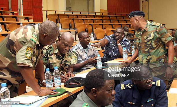 Officers of the Economic Community of West African States and Malian offciers talk on the deployment of ECOWAS force in Mali on July 7, 2012 in...