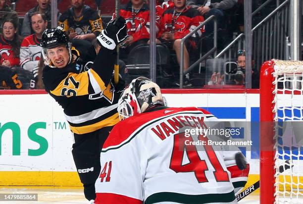 Rickard Rakell of the Pittsburgh Penguins misses the net during the third period against Vitek Vanecek of the New Jersey Devils at the Prudential...