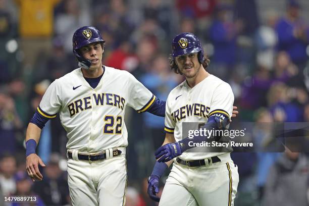 Brian Anderson of the Milwaukee Brewers is congratulated by Christian Yelich following a two run home run against the New York Mets during the...