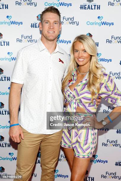 Ryan Tannehill and Lauren Tannehill, wearing The Covenant School ribbon, attend the Pro Football Hall Of Fame's Family Recovery Fund charity concert...