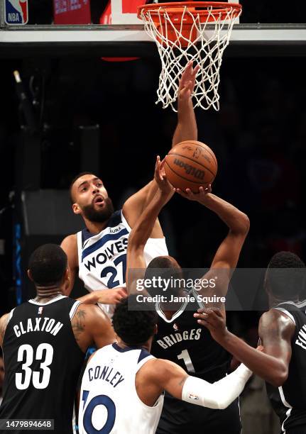 Rudy Gobert of the Minnesota Timberwolves blocks a shot by Mikal Bridges of the Brooklyn Nets during the game at Barclays Center on April 04, 2023 in...