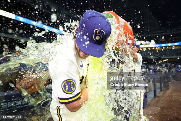 Brian Anderson of the Milwaukee Brewers is dunked following a game against the New York Mets at American Family Field on April 04, 2023 in Milwaukee,...