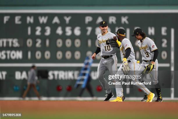 Bryan Reynolds, Ji Hwan Bae, and Andrew McCutchen of the Pittsburgh Pirates celebrate after defeating the Boston Red Sox at Fenway Park on April 04,...