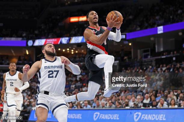 Shaquille Harrison of the Portland Trail Blazers goes to the basket against David Roddy of the Memphis Grizzlies during the second half at FedExForum...