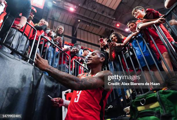 Kevin Porter Jr. #3 of the Houston Rockets poses for a photo with fans after defeating the Denver Nuggets at Toyota Center on April 04, 2023 in...