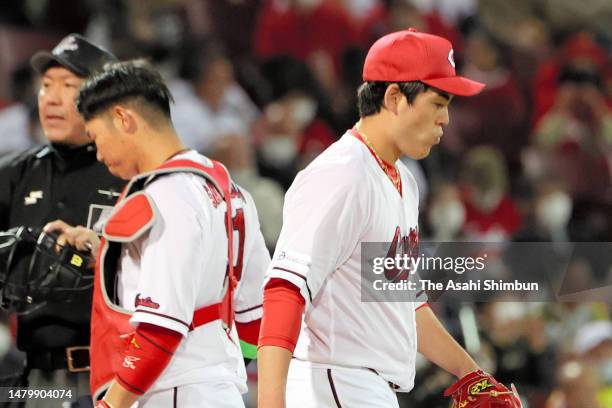 Aren Kuri of the Hiroshima Carp reacts after allowing Shota Morishita of the Hanshin Tigers a RBI double in the fourth inning against Hiroshima Carp...