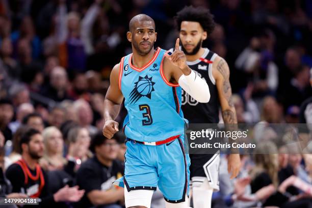 Chris Paul of the Phoenix Suns gestures after making a three-point basket against the San Antonio Spurs during the first half at Footprint Center on...