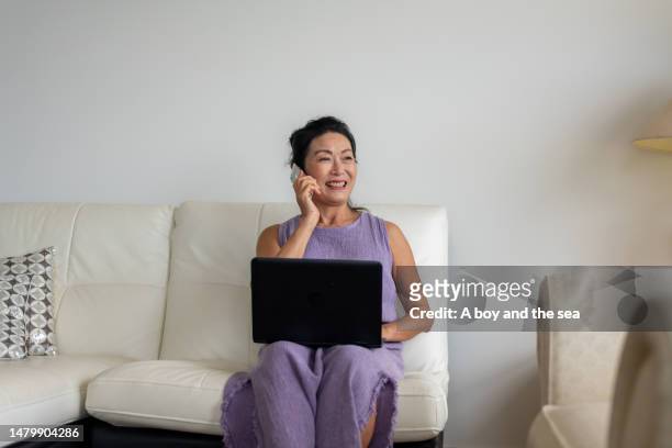retired woman running a small business from home - economy business and finance stock pictures, royalty-free photos & images