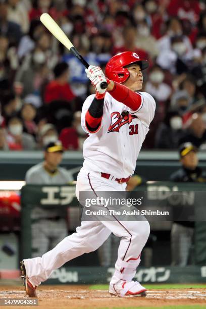 Shogo Sakakura of the Hiroshima Carp hits a two run home run in the seventh inning against Hanshin Tigers at Mazda Zoom-Zoom Stadium Hiroshima on...