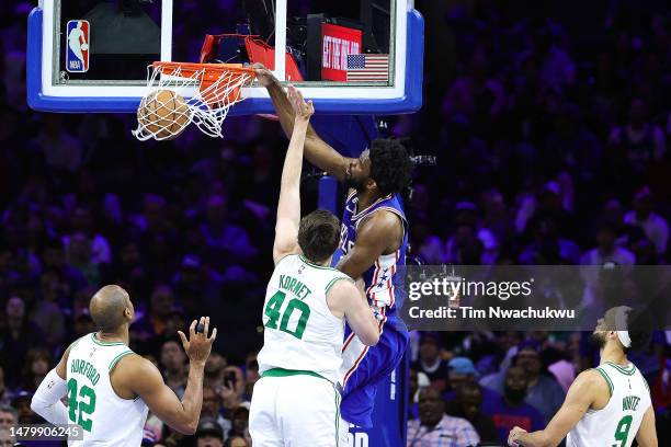 Joel Embiid of the Philadelphia 76ers dunks past Luke Kornet of the Boston Celtics during the third quarter at Wells Fargo Center on April 04, 2023...