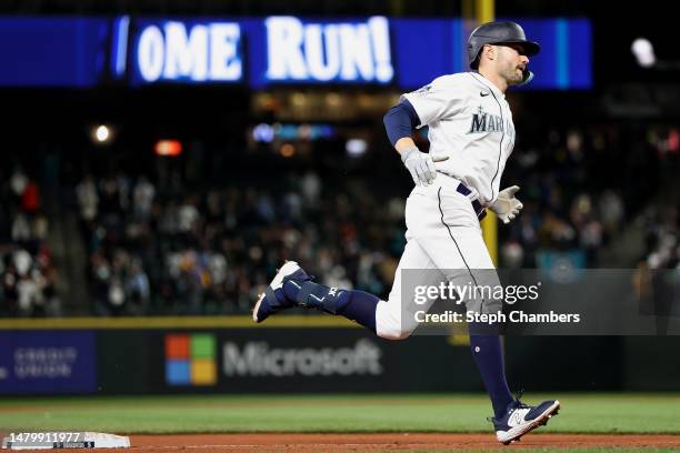 Pollock of the Seattle Mariners celebrates his two run home run against the Los Angeles Angels during the seventh inning at T-Mobile Park on April...