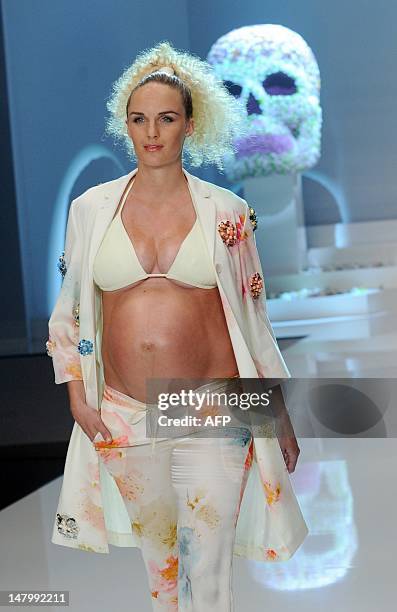 Pregnant model Patricia Kaiser presents fashion by German designer Michael Michalsky during the Michalsky Style Night offsite at the Mercedes-Benz...