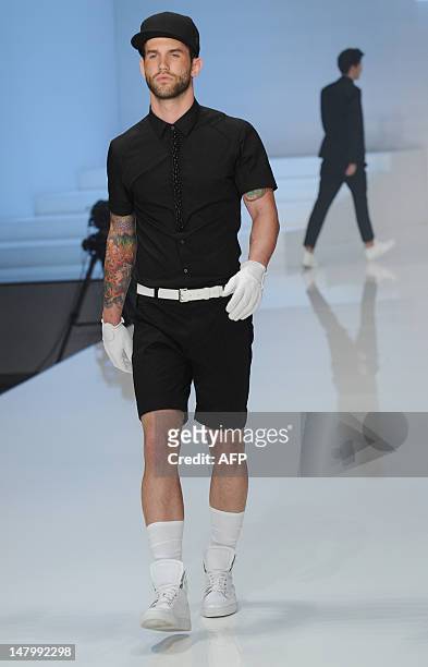 Model presents fashion by German designer Michael Michalsky during the Michalsky Style Night offsite at the Mercedes-Benz Fashion Week in Berlin on...