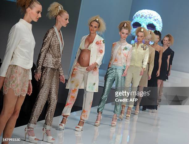 Models present fashion by German designer Michael Michalsky during the Michalsky Style Night offsite at the Mercedes-Benz Fashion Week in Berlin on...