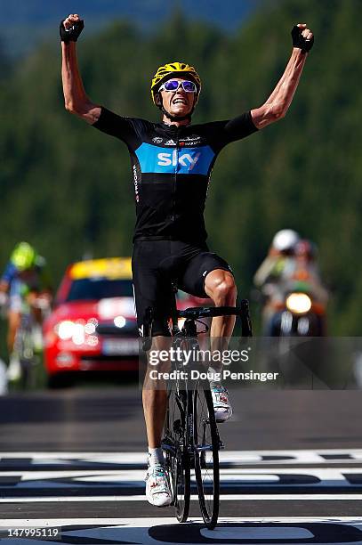 Chris Froome of Great Britian riding for Sky Procycling celebrates as he crosses the finish line to win stage seven of the 2012 Tour de France from...