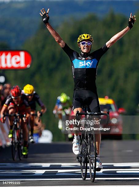 Christopher Froome of Great Britian riding for Sky Procycling celebrates as he crosses the finish line to win stage seven of the 2012 Tour de France...