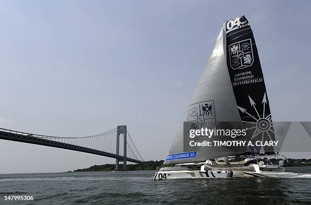 Edmond de Rothschild Group sails towards the Verrazano-Narrows Bridge after the start in the KRYS Ocean Race on July 7, 2012 in New York. Five...