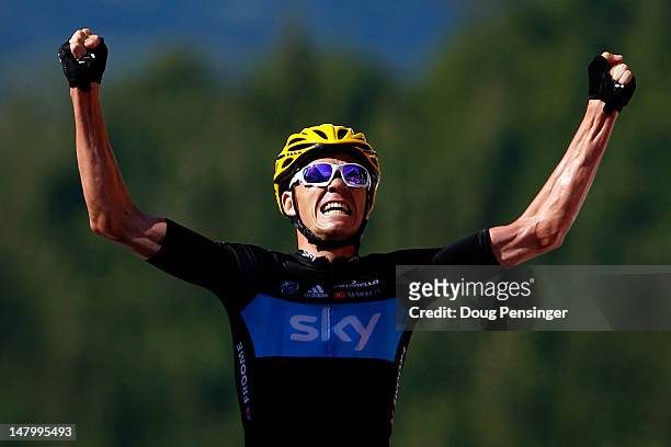 Christopher Froome of Great Britian riding for Sky Procycling celebrates as he crosses the finish line to win stage seven of the 2012 Tour de France...