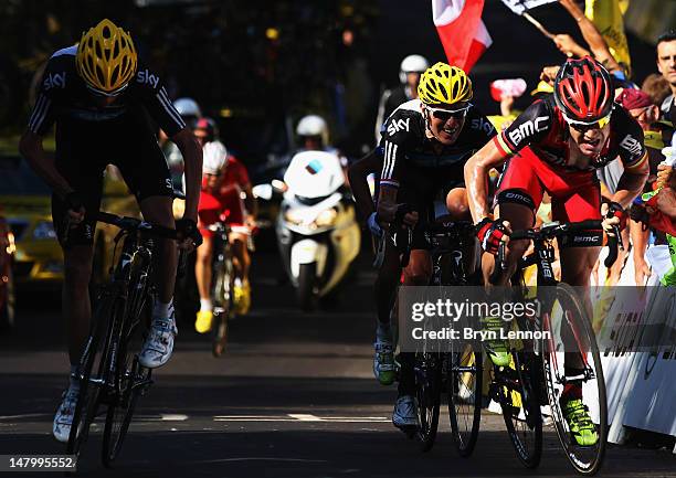 Cadel Evans of Australia and the BMC Racing Team leads Bradley Wiggins of Great Britain and SKY Procycling and Chris Froome of Great Britain and SKY...