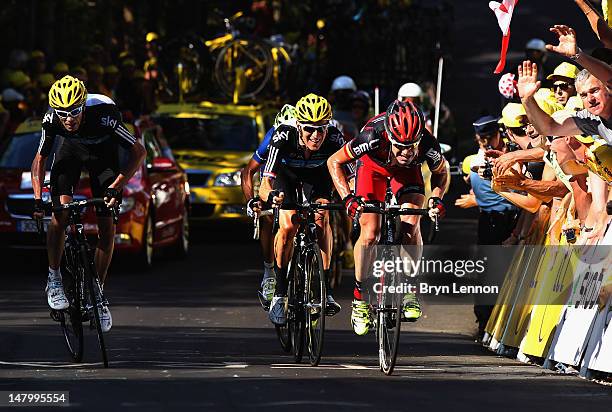 Cadel Evans of Australia and the BMC Racing Team leads Bradley Wiggins of Great Britain and SKY Procycling and Chris Froome of Great Britain and SKY...