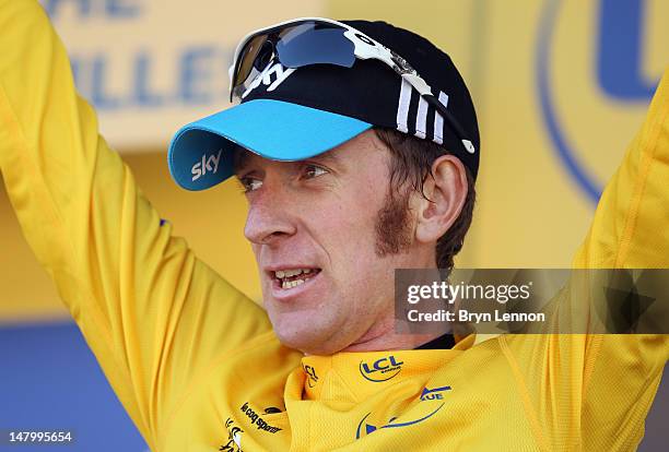 Bradley Wiggins of Great Britain and SKY Procycling celebrates taking the race leader's yellow jersey during stage seven of the 2012 Tour de France...