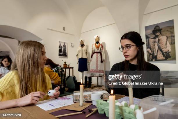 Olesia Pankiv demonstrates how to make pysanky on April 1, 2023 in Lviv, Ukraine. Pysanky is the art of writing with wax on eggs to make Ukrainian...