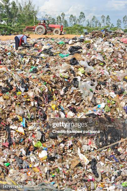 trash landfill garbage pile in the agriculture field. - climate action stock pictures, royalty-free photos & images