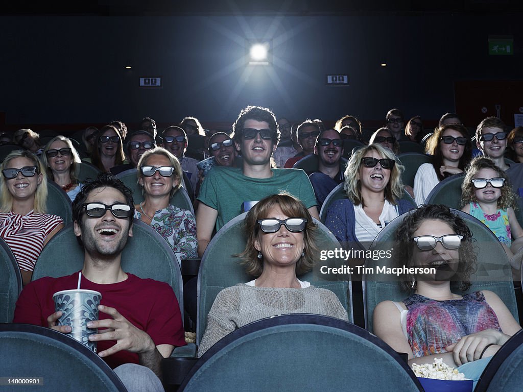 People watching a movie at a theater