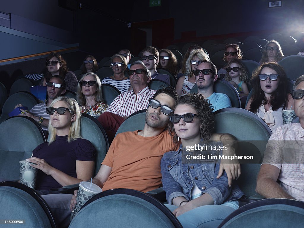 People watching a movie at a theater