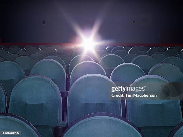 an empty movie theater - cinema seats stockfoto's en -beelden