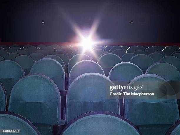 an empty movie theater - theater seat stock pictures, royalty-free photos & images