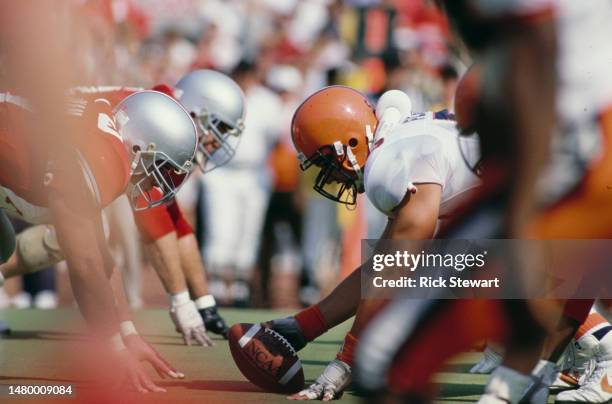 John Flannery, Offensive Guard and Center for the Syracuse University Orange prepares to snap the football on the line of scrimmage during the NCAA...