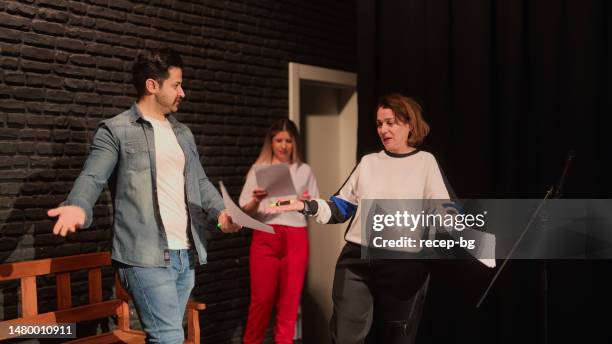 group of theater stage performers rehearsing on stage - improvisatie stockfoto's en -beelden