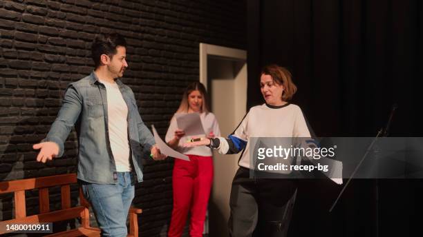 group of theater stage performers rehearsing on stage - improv stock pictures, royalty-free photos & images