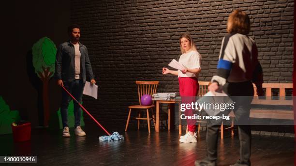 group of theater stage performers rehearsing on stage - improvisatie stockfoto's en -beelden