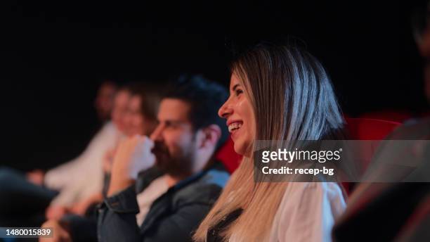 audiences sitting on seats and enjoying their time - theatre industry stock pictures, royalty-free photos & images