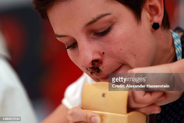 Competitor snuff during 18th Snuff World Championships on July 7, 2012 in Peutenhausen near Munich, Germany. 290 participants from Germany, Austria,...
