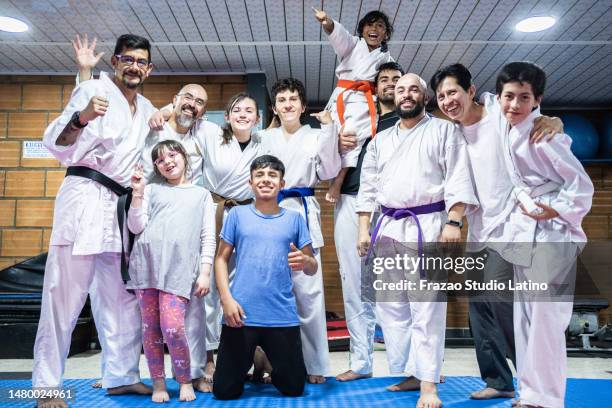 portrait of karate students during a karate class - taekwondo stock pictures, royalty-free photos & images