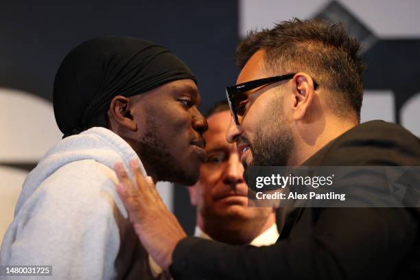 Joe Fournier pushes KSI as they pose face off during a press conference ahead of the fight between KSI and Joe Fournier at Glaziers Hall on April 05,...