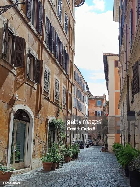 alley with buildings in rome old town, italy - narrow foto e immagini stock