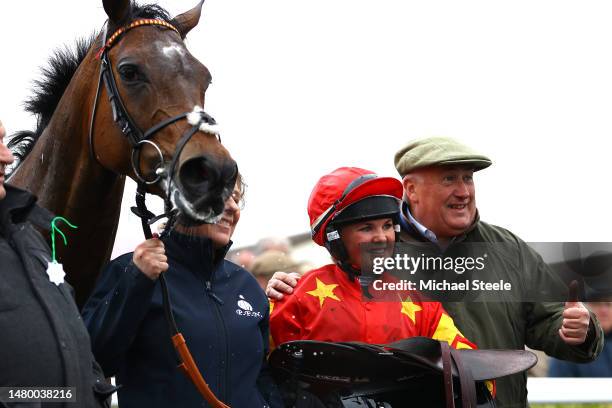 Olive Nicholls is all smiles in the winners enclosure alongside father and trainer Paul Nicholls after riding Oscars Moonshine to victory in the...